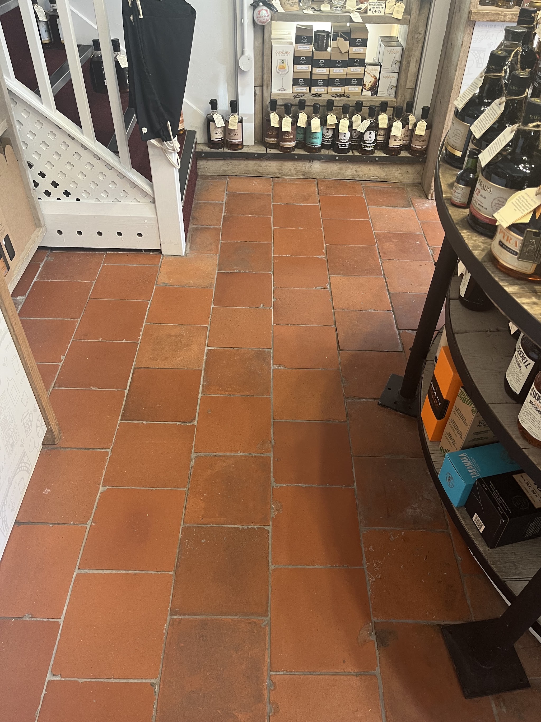 Clean quarry tiled floor inside a small shop in Ironbridge