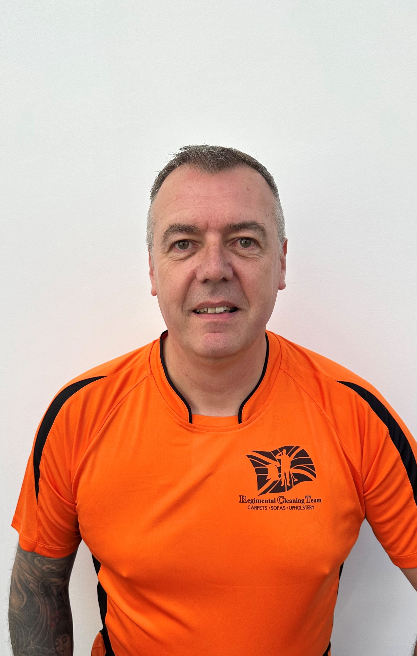 Pete Hansen in his orange Regimental Cleaning Team shirt